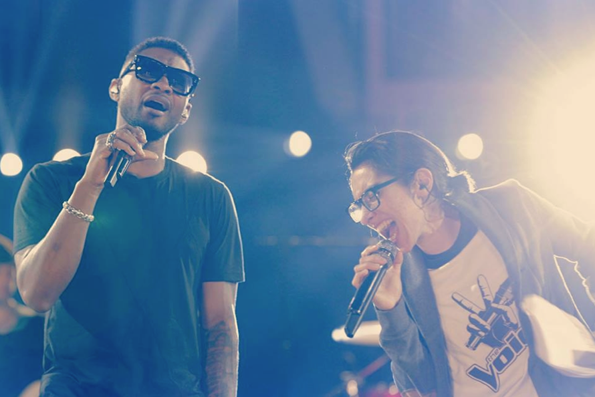 Usher and Michelle Chamuel performing on 'The Voice'