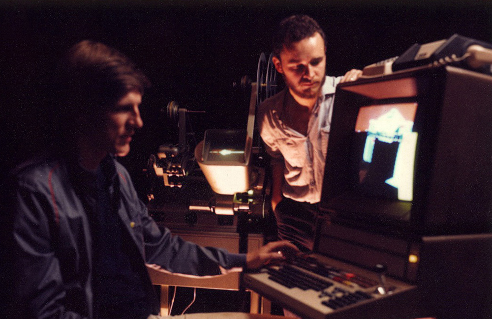 Bill Kroyer and Jerry Rees working on "Tron". — Polaroid by Tom Zimberoff