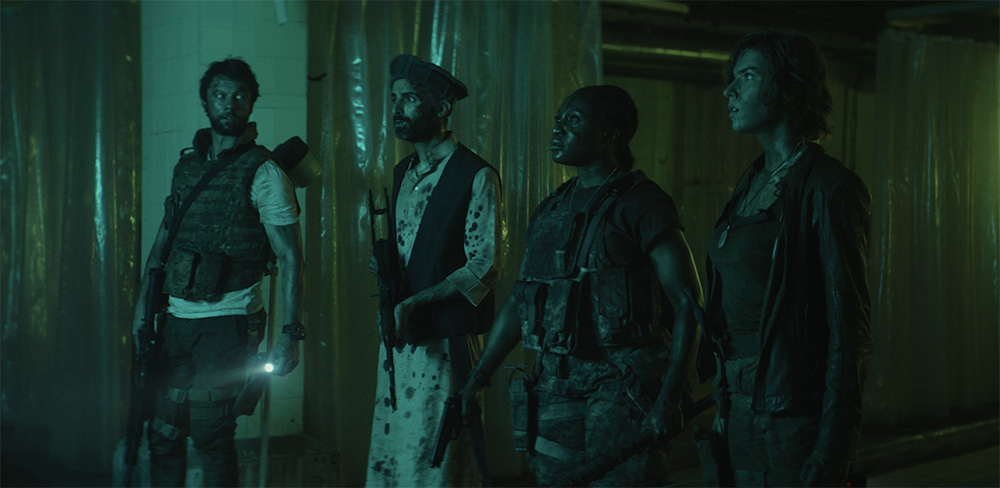 Kibong Tanji, Leon Ockenden, Charlotte Kirk, and Hadi Khanjanpour in 'The Lair.'